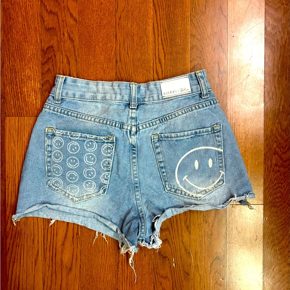 Khaki + Blue high-waisted smiley face denim shorts. Size 3 - 26” waist. EUC